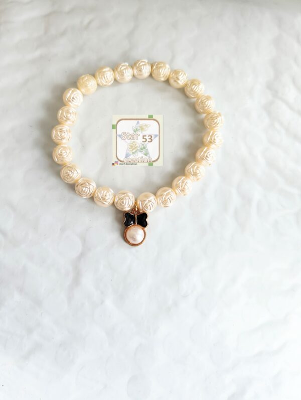 rose stamped pearls bracelet, bow charm